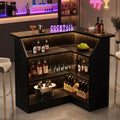 Fnova L-Shaped Home Bar Unit with Metal Footrest, 4-Tier Corner Liquor Display Unit, Versatile Reception Desk with Storage, Black